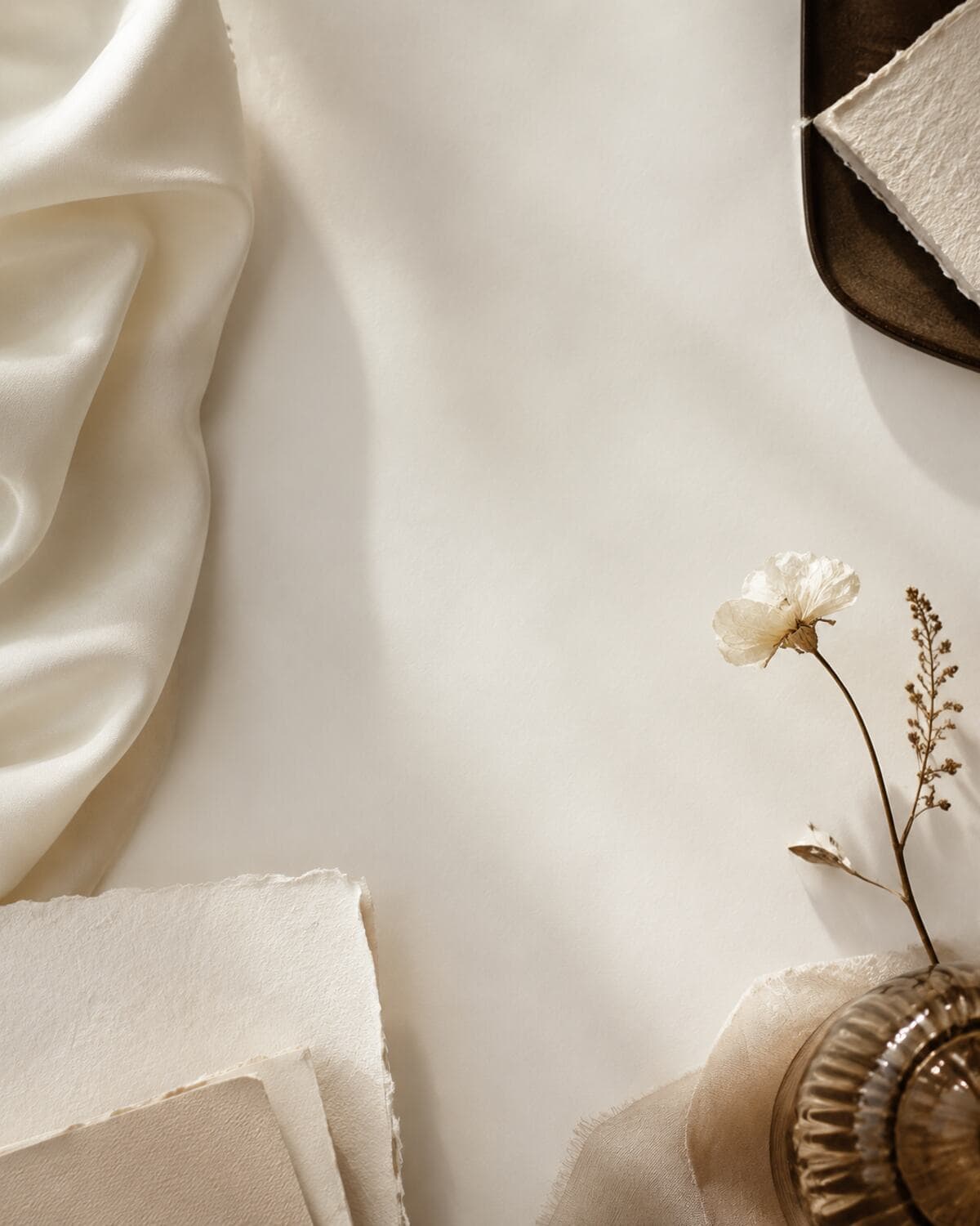 Ivory paper, silk, and delicate dried flowers